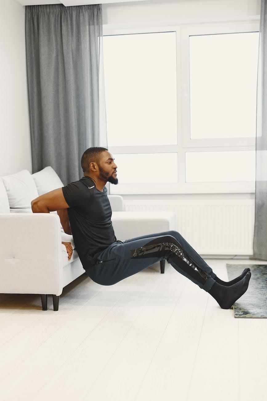 a man working out doing reverse pushups