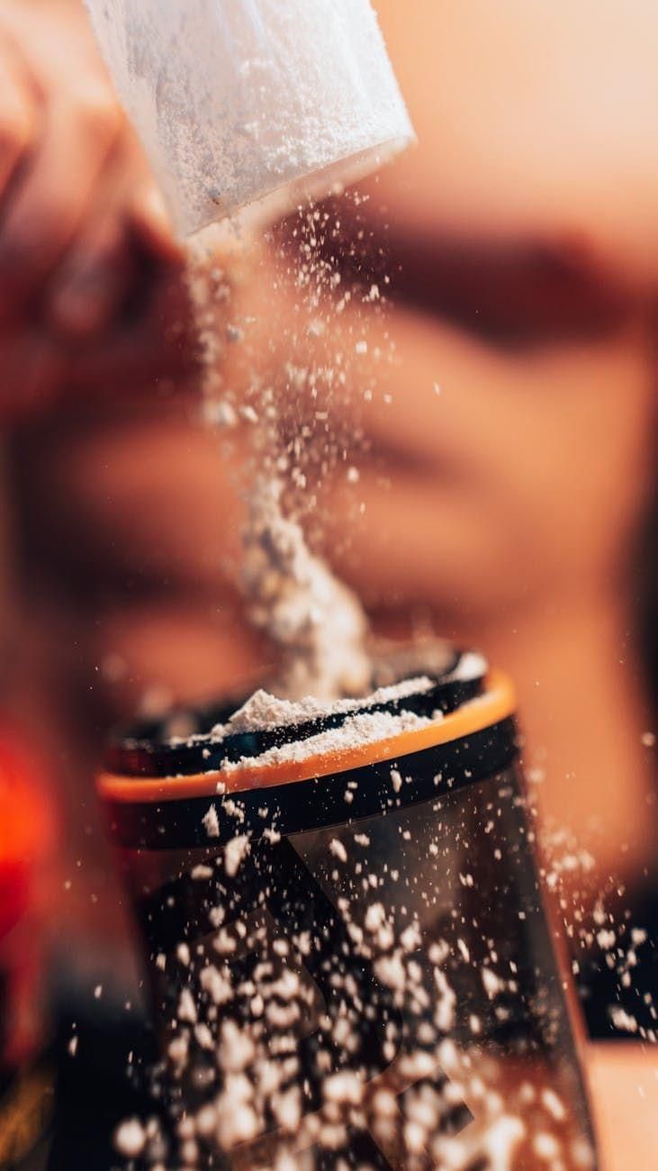 pexels-photo-15120889 close up of preparing protein shake with powder